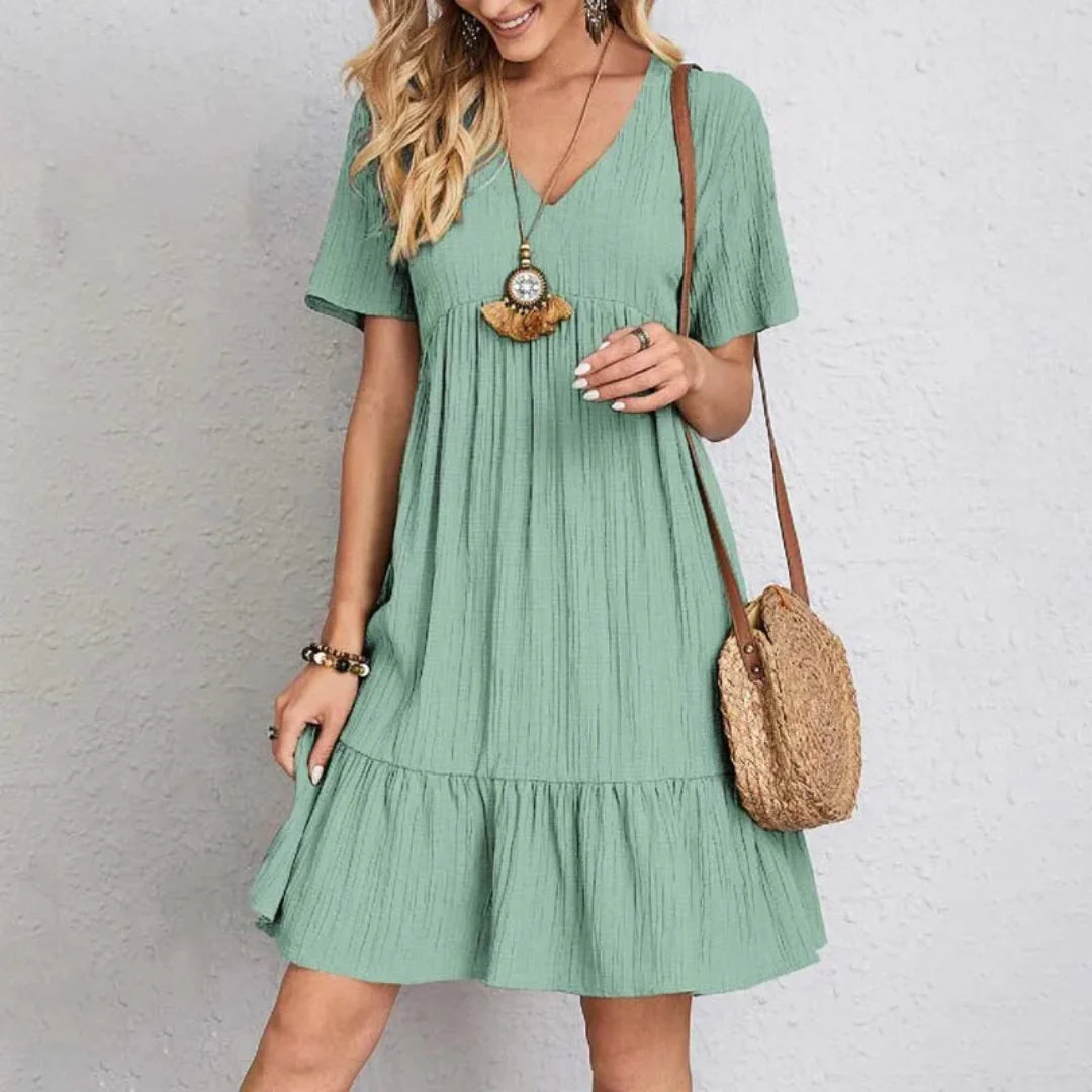 Sabine Riviera Kleid – V-Ausschnitt &amp; verspielt